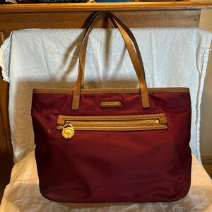 Michael Kors wine colored nylon purse with 2 leather handles